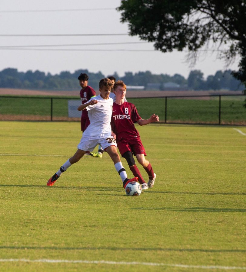 Jake Romerhausen passes the ball to an open midfielder.