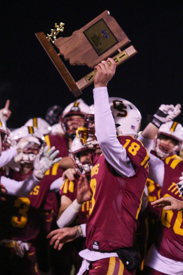 After a five year drought, senior Brady Allen hoists the Sectional trophy for the Titan football team.