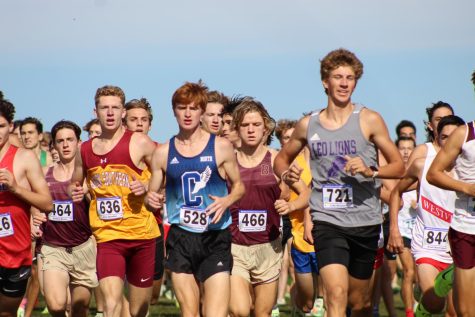 Junior Alex Spindler starts the State meet at the front of the pack, keeping pace with race leaders.