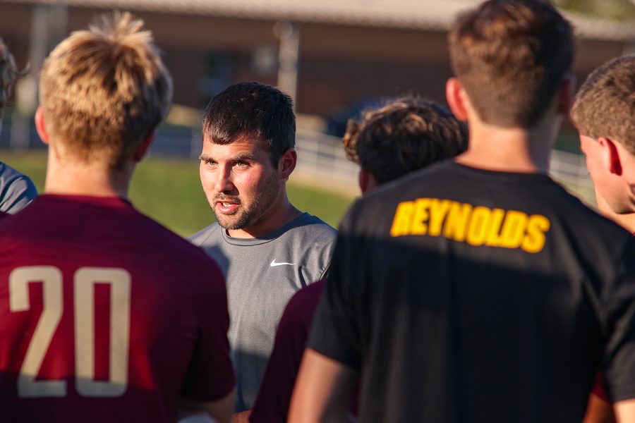 Former Titan mens soccer coach Josh Higgins gives his team a pep talk just before starting the second half of their Sept. 1 game against South Spencer. Higgins resignation took the team by surprise earlier this month.