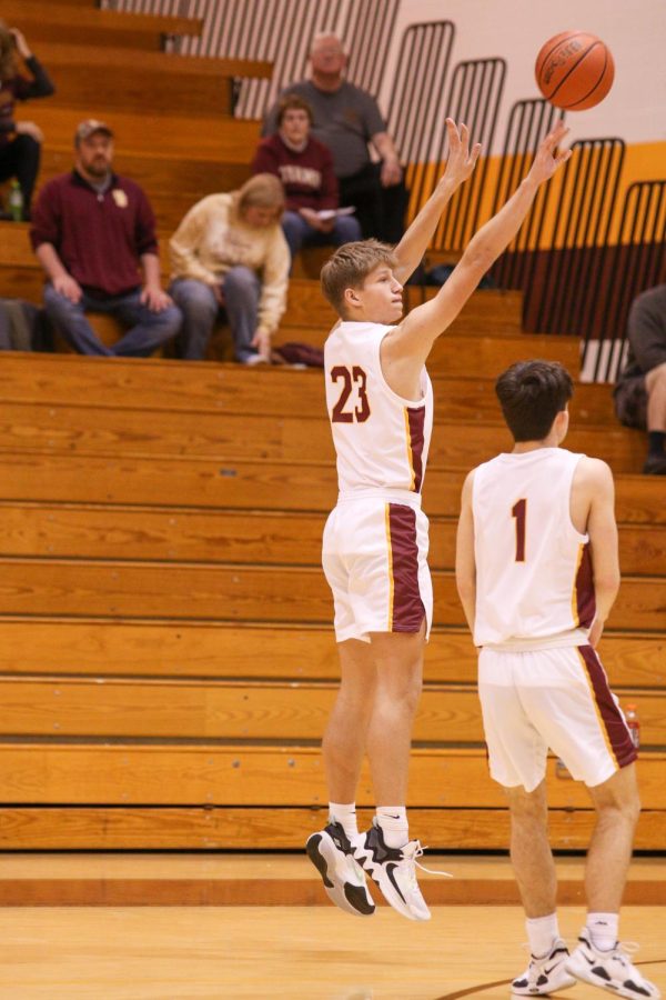 Sophomore Cam Novotny goes up for a shot against the Bosse Bulldogs. 