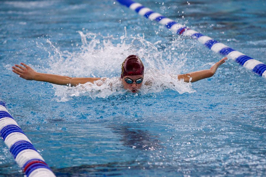 Junior Laira Cloin competes in the 100 yard butterfly at the Sectional prelims on Thursday, February 2.