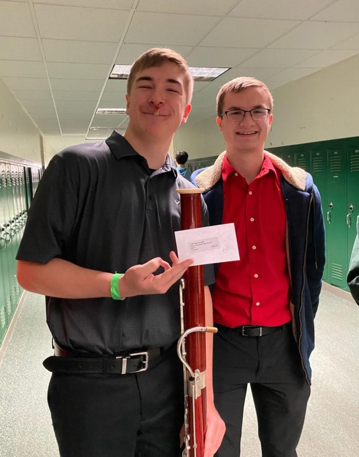 Freshman Isaac Douglas shows of his gold rating for his bassoon solo. 