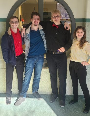 Senior Tristan Colburn is all smiles after earning a gold rating at the District solo and ensemble competition. Fellow seniors Caleb Douglas, Bronson Ivy and Annalise Folsom were there to support him.