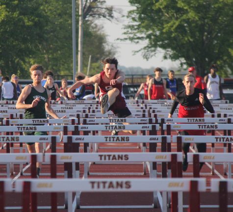 Junior Lucian Wicker leads the pack in hurdles at the home meet on April 28.