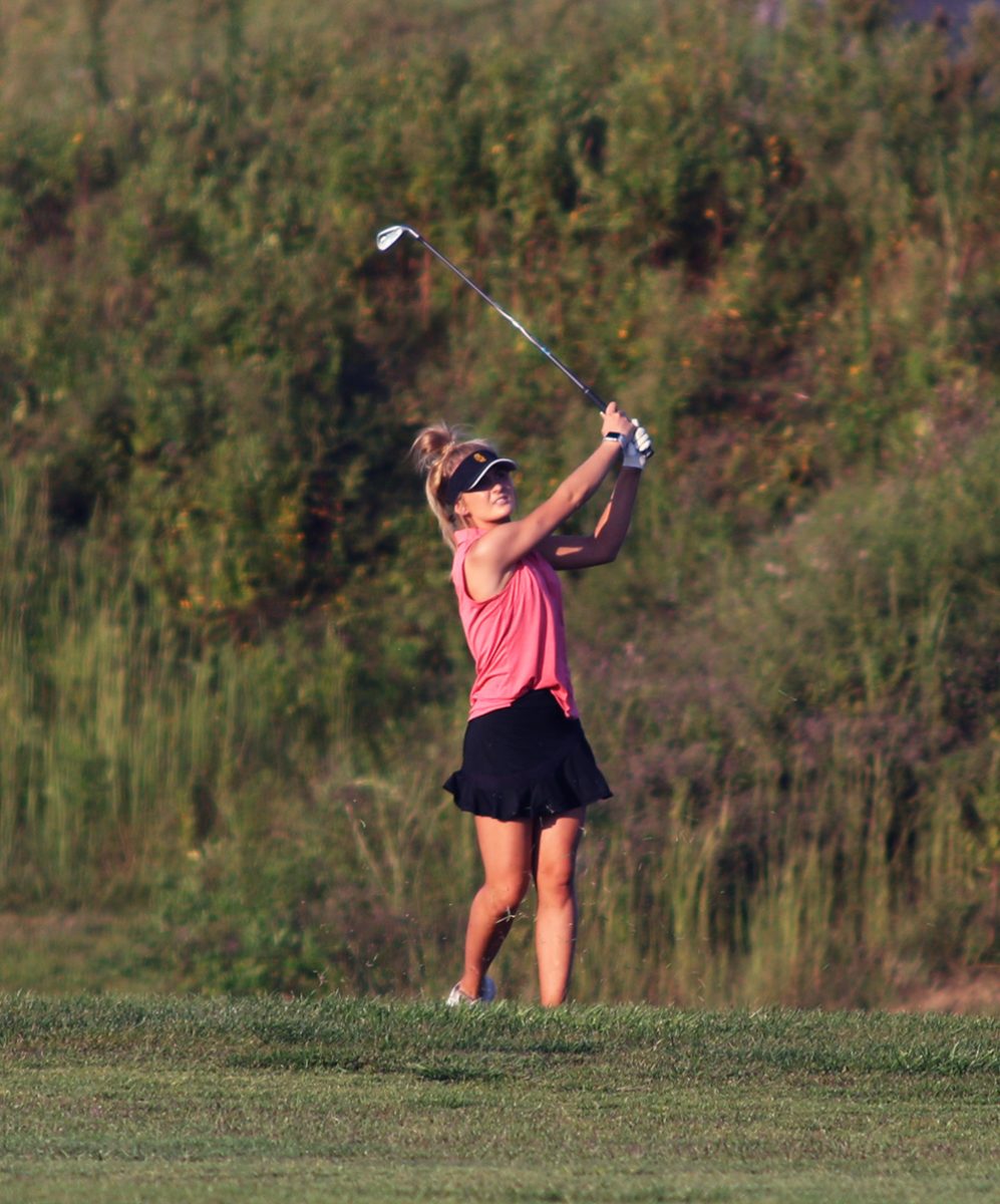 Senior Aubree Davis brings her ball back onto the fairway from the rough on September 13, when the Lady Titans hosted the Mater Dei Lady Wildcats.