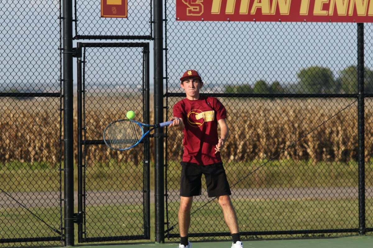 Junior Lucas Church returns a serve from Forest Park on Sept. 25. Churchs Sectional win gave Gibson Sothern the one point victory over country Rival Princeton for the boys tennis Sectional title on Saturday, Sept. 30.