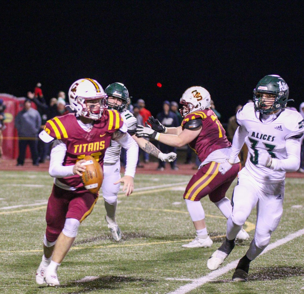 Senior quarterback Tanner Boyd looks for an open receiver during the Sectional championship against Vincennes Lincoln.