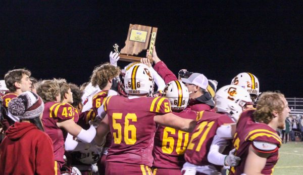 Gibson Southern Principal Jon Adams presents the Titans with the 2023 Sectional trophy at the Jewell on Friday, Nov. 3.