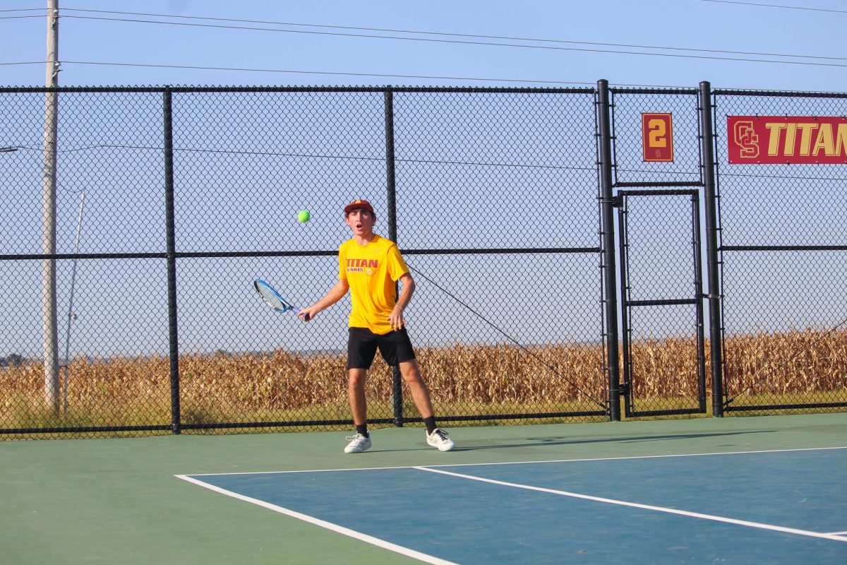 Senior Lucas Church, number two singles player, returns a volley in his match against Princeton.