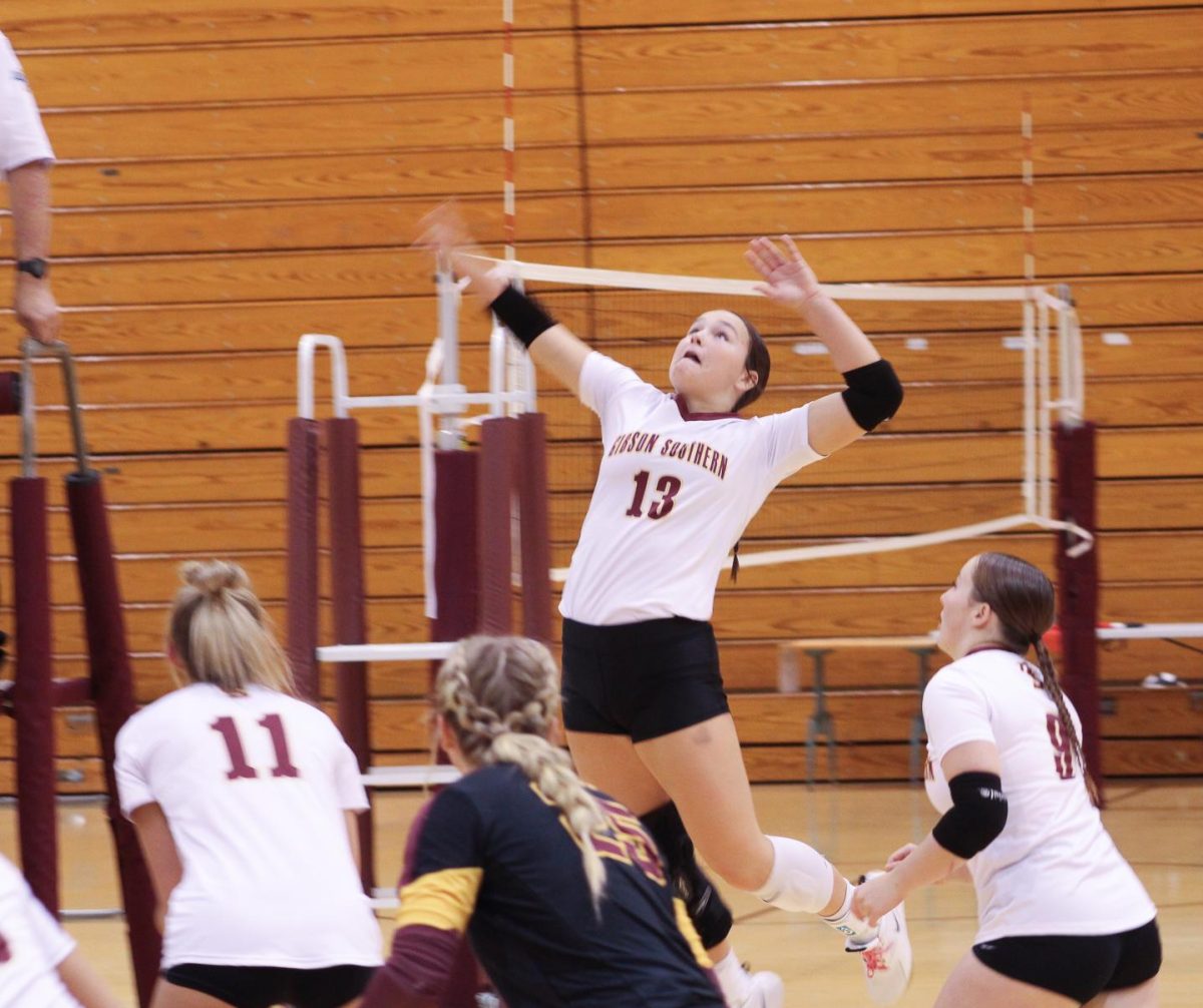 At the September 10 game against Reitz, senior Lauren Adamson sends a shot hurtling onto the Panter's side of the court.