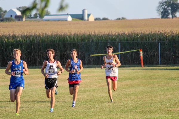 Sophomore Reece Runyan works his way through the last portion of the Titan cross country course at the 2024 Alan Hopewell Classic.