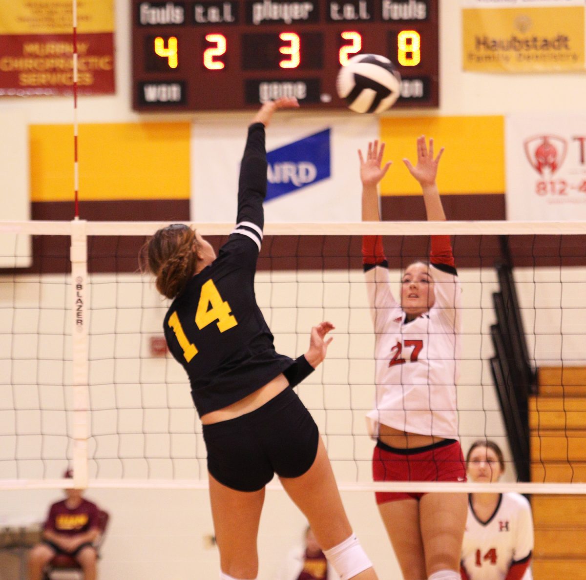 Sophomore Adelynn Snow sends a spike hurtling into Harrison's court at the September 9 game at Gibson Southern, where the Lady Titans won in three sets.