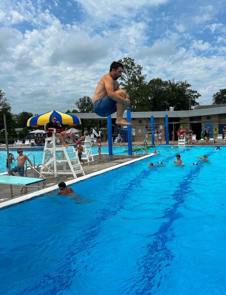 Practicing the perfect cannonball form, this is two jumps into the pool before history teacher and girls basketball coach Kyle Brasher hurt himself. Brasher missed the start of the school year due to surgery.