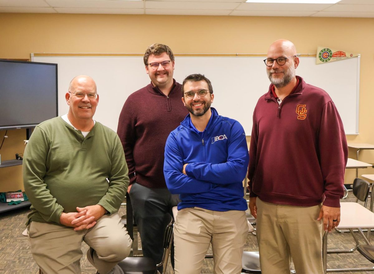 Veteran teachers of the history department, Michael Priar, Kyle Brasher and Marvin Susott, give second-year teacher Devin Murphy advice and assistance to help him navigate the profession.