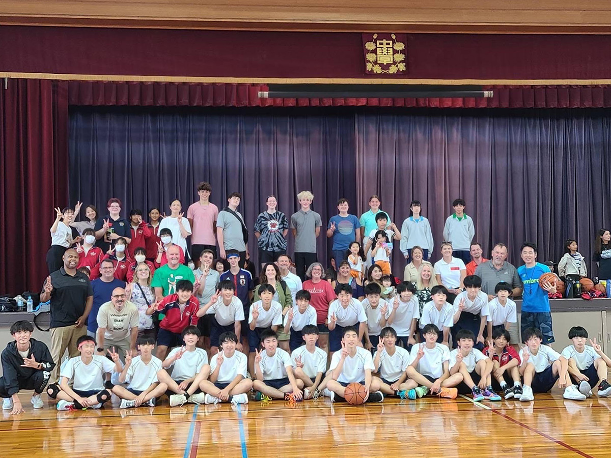 Gibson Southern representatives Regan Wolak, Elijah Ortiz, Grant Arbuckle, and computer sciences teacher Ryan Osborn played basketball with students at a school in Japan, along with the rest of the Gibson County delegates.