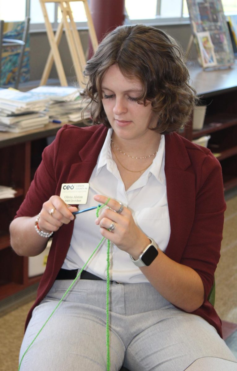 Junior Olivia Alston relaxes after school while crocheting with art teacher Laura Russell. The Crochet and Textiles Club meets 3:15 p.m. - 4:00 p.m. every Tuesday and Wednesday in the art room.