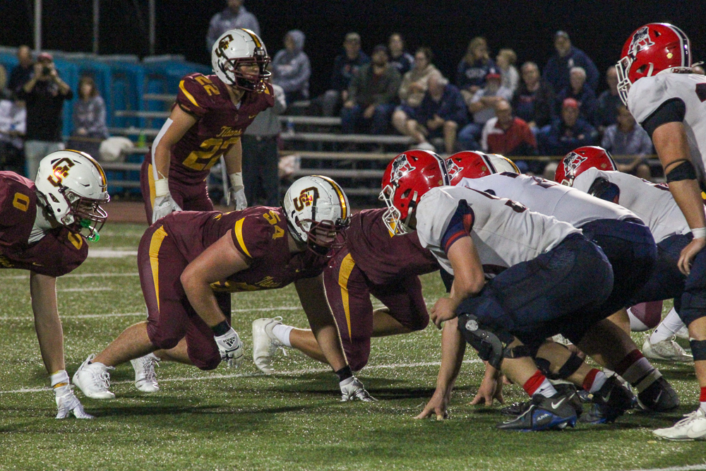 Juniors Colin Scherer, number 22, and Brody Klem, number 54, take the line to hold off Heritage Hills.