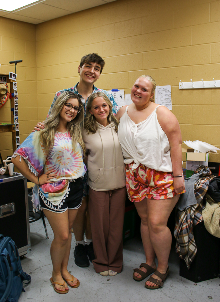 Seniors Jenna Schleter, Jonnie Dixon, Brielle Armstrong and junior Kenzie Shellhaas get mic'd up for the stage.