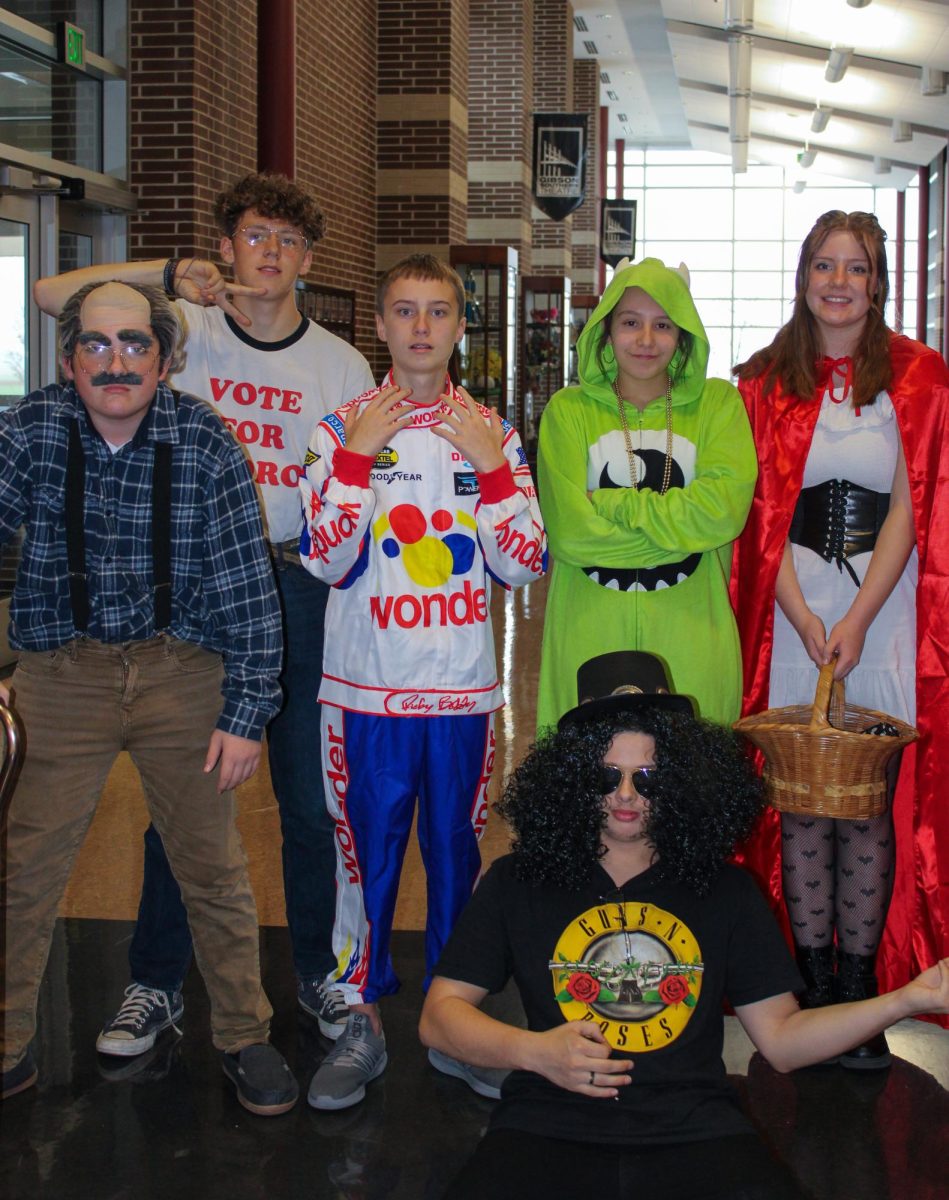 Freshmen Izayah Shanks, Miles Wilson, sophomore Wyatt Stuessel, Elliana Bittner, Madison Naas and junior Peyton Miller dress for the best solo costume category.