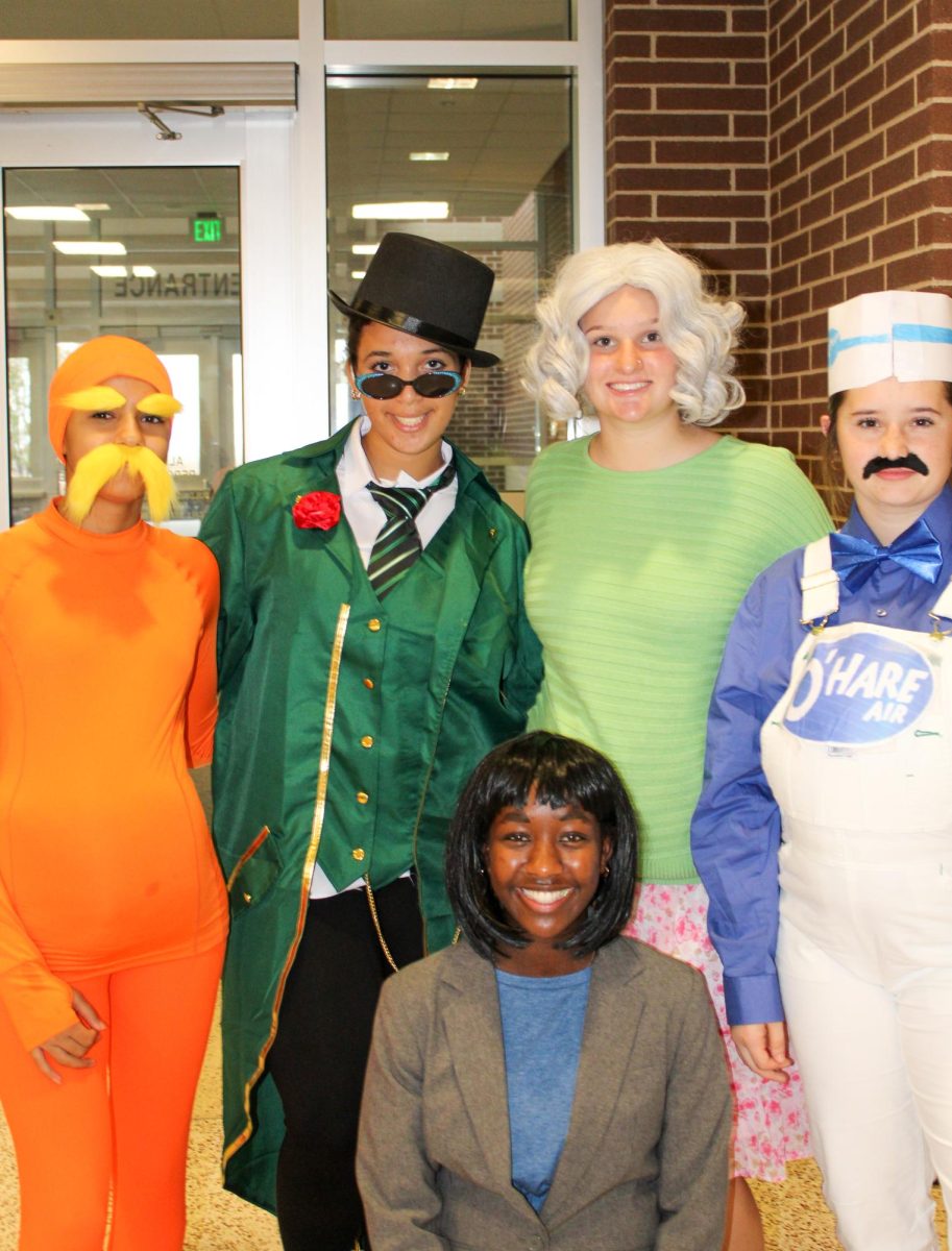 Freshmen Olivia Thomas, Jaycee Kramer, Peyton Rowe, Tes Weber and Raylee Penner dress as "The Lorax" in the group costume category.