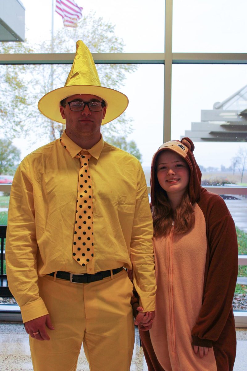 Junior Brody Klem and Sara Creek dress as characters from "Curious George" in best duo category.