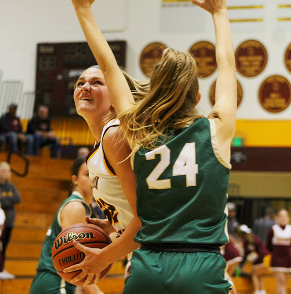 Freshman Paige Schnaus turns to the basket for an easy two points against Forest Park on November 14.