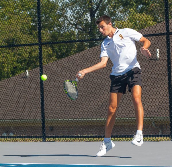 Senior Landon Schmitt returns a volley earlier in the season when the team traveled to Silver Creek for a two-day tournament.