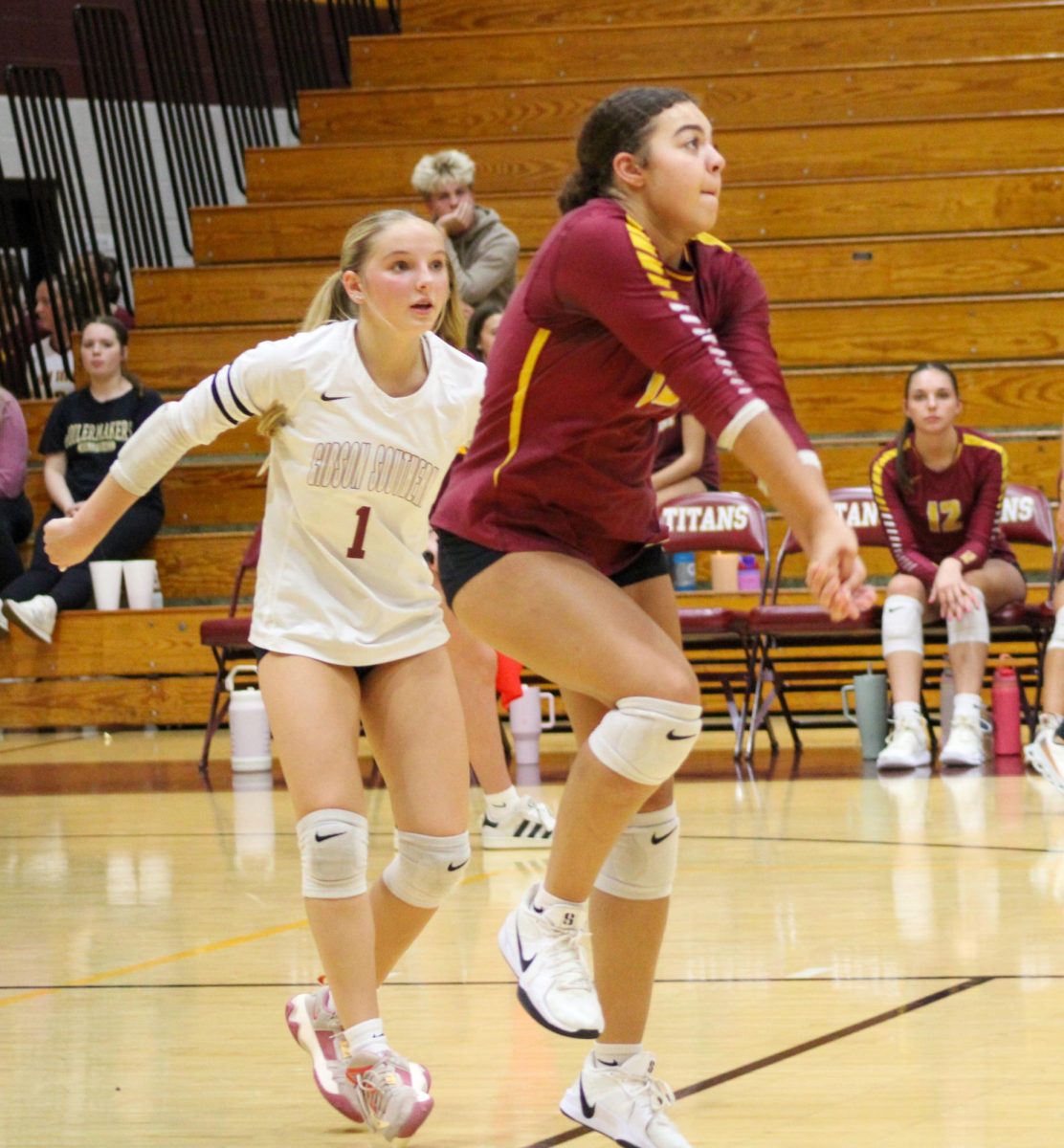 Sophomore Cashmire Spears returns the ball while sophomore Rigsby Traylor covers her during the Lady Titans' home game against Vincennes Lincoln on October 6.
